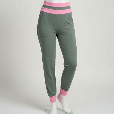green and pink joggers on a mannequin